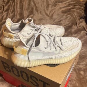 Yeezy Cream and Gold Sneakers